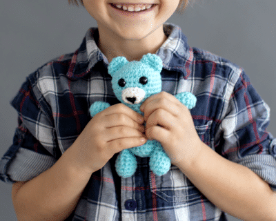 child with amigurumi crochet basket